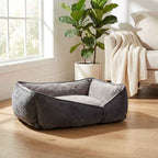Gray flat orthopaedic dog bed with raised side walls and padded inner mattress