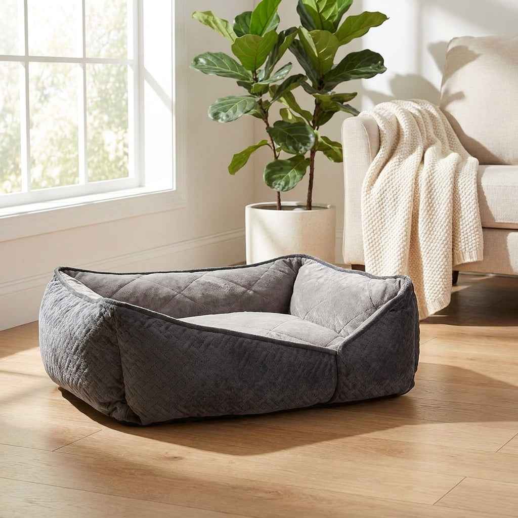 Gray flat orthopaedic dog bed with raised side walls and padded inner mattress